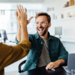 Business people celebrating success in an office